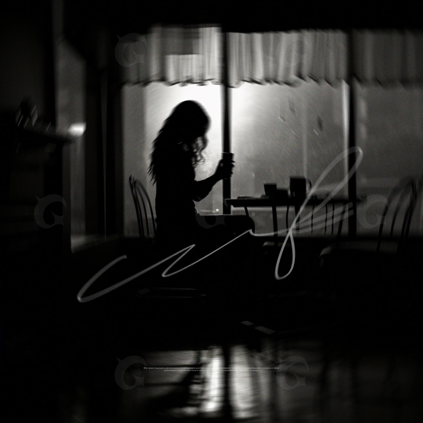 Silhouette holding mug
