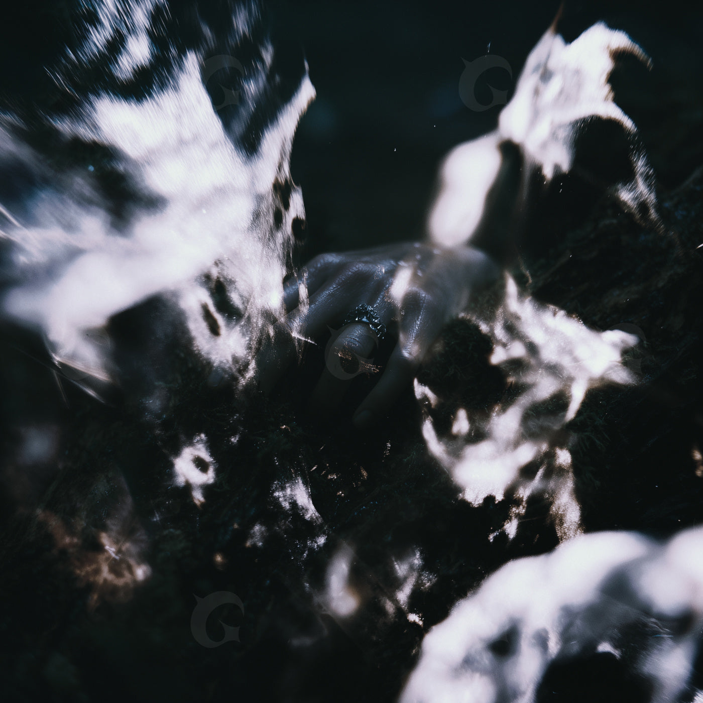 Hand emerging from darkness