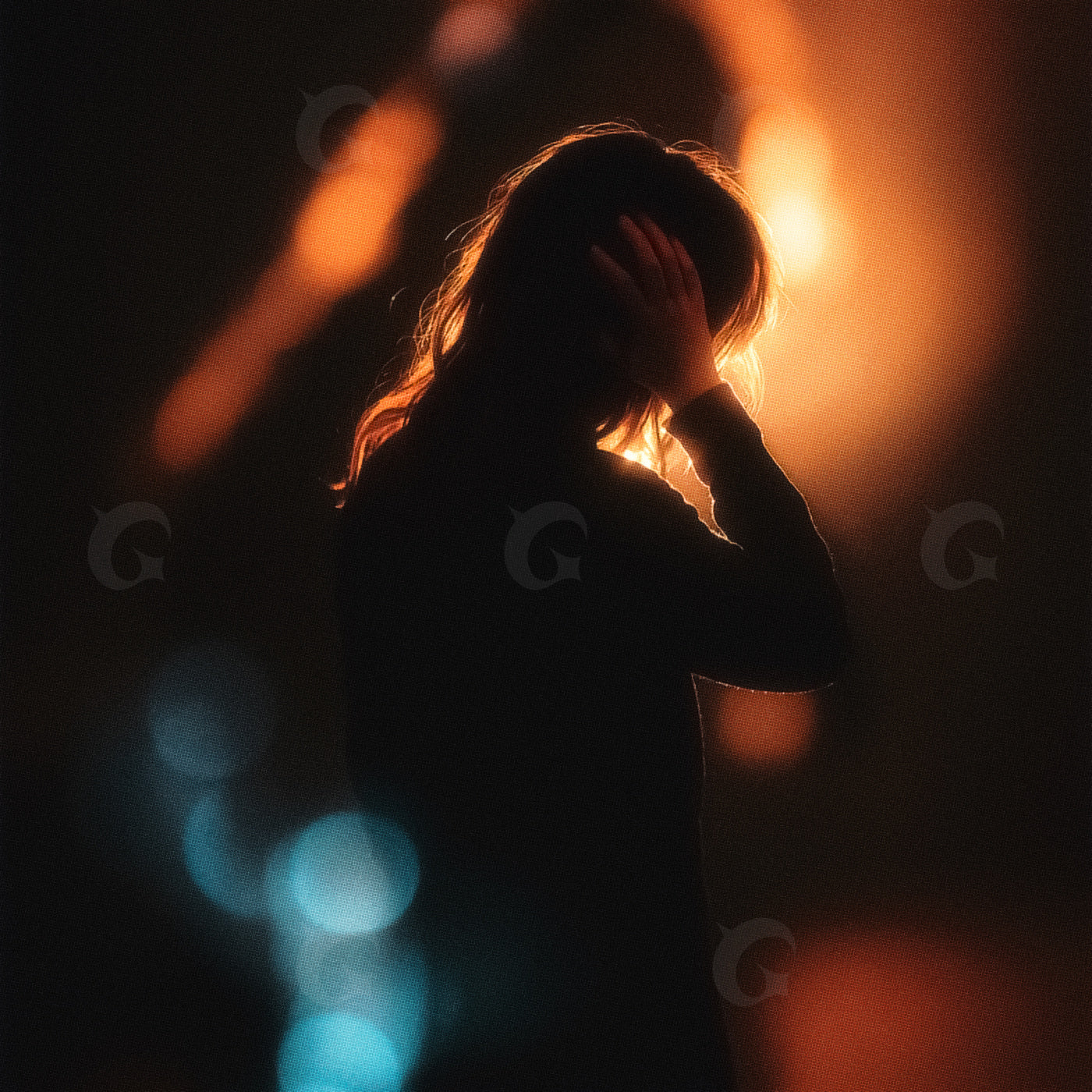 Silhouette against streetlights